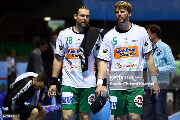 Pavel Horak and Manuel Spaeth of Goeppingen look dejected after the EHF Cup Semi Final match between Frisch Auf Goeppingen and Rhein-Neckar Loewen at...
