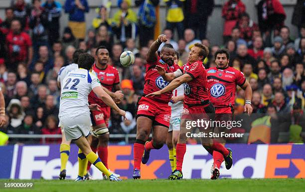 Toulon captain Jonny Wilkinson and Mathieu Bastareaud combine to thwart the drop goal attempt of David Skrela during the Heineken Cup final match...