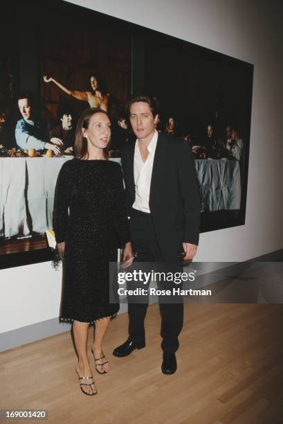 Artist Sam Taylor-Wood and actor Hugh Grant in front of Taylor-Wood's 'Wrecked' at the Sensation Benefit and Exhibition Preview at the Brooklyn...