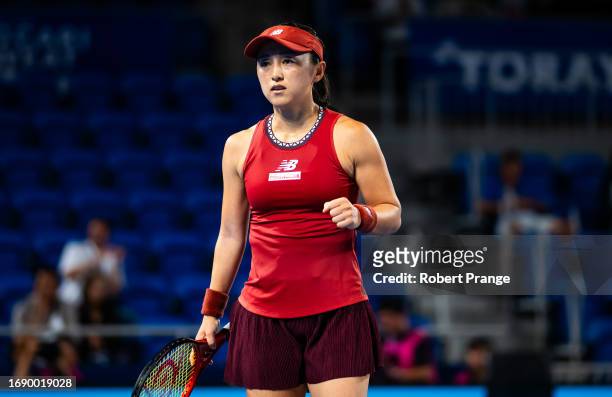 Misaki Doi of Japan in action against Petra Martic of Croatia during the first round on Day 2 of the Toray Pan Pacific Open at Ariake Coliseum on...