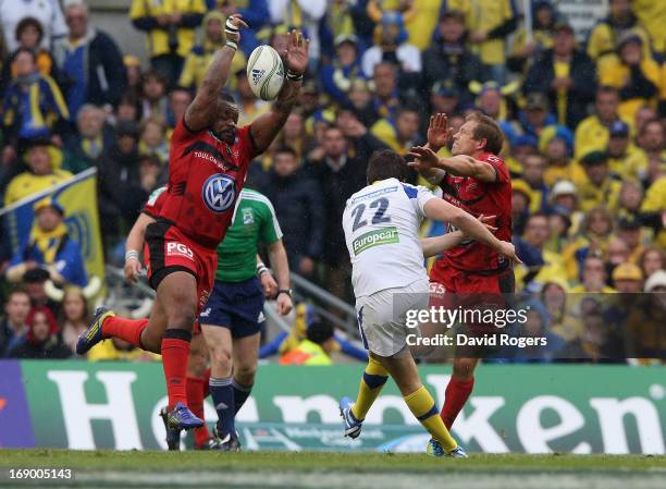 Mathieu Bastareaud and Jonny Wilkinson charge down a late drop goal attempt by David Skrela during the Heineken Cup final match between ASM Clermont...