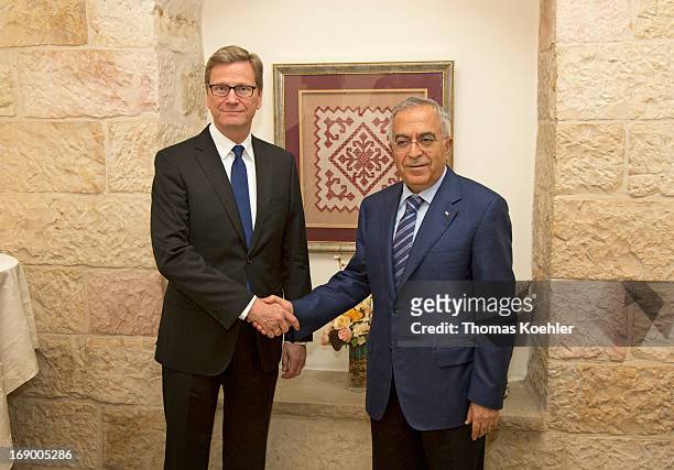 German Foreign Minister Guido Westerwelle meets the Prime Minister of the Palestinian National Authority, Salam Fayyad, on May 18, 2013 in Ramallah,...