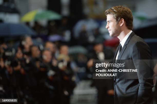 Australian actor Liam Hemsworth poses on May 18, 2013 as he arrives for the screening of the film "Jimmy P. Psychotherapy of a Plains Indian"...