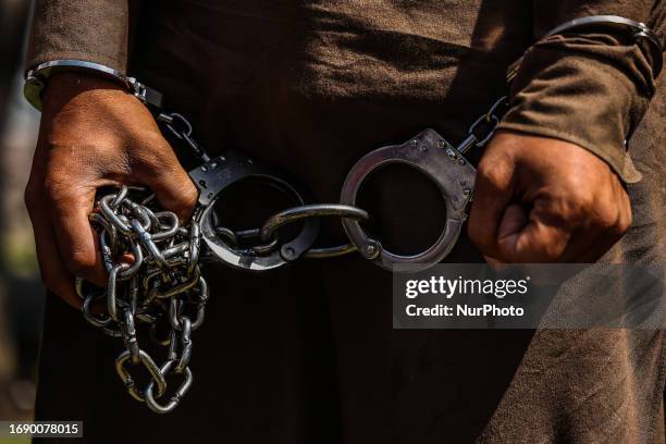 Handcuffed militant after BARAMULLA police and Indian Army arrested Militant and their associates including women in Baramulla Jammu and Kashmir...