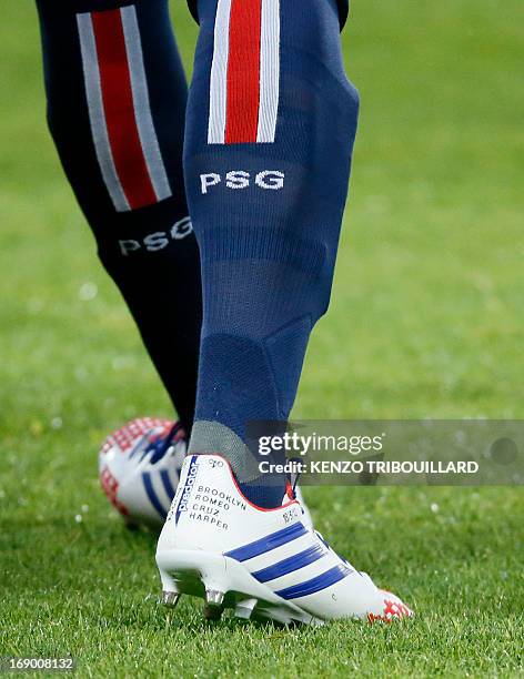 Paris Saint-Germain's English midfielder David Beckham's boots with the names of his four children on the heel during a French L1 football match...