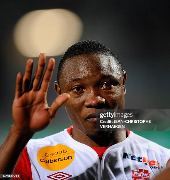 Nancy's Cameroonian forward Paul Alo'o Efoulou cries at the end of the French L1 football match Nancy vs Bastia at Marcel Picot Stadium, on May 18,...