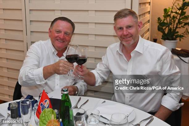 Team USA Paul Levy and Team Europe Captain Stephen Gallacher make a toast during the Welcome Dinner before the Junior Ryder Cup at Golf Nazionale on...