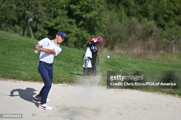 Miles Russell hits out of the bunker on the 17th hole during a practice round before the Junior Ryder Cup at Golf Nazionale on Monday, September 25,...