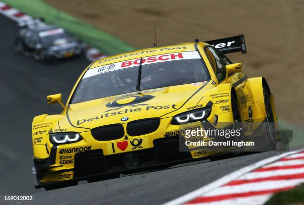 Timo Glock of Germany drives the MTEK Deutsche Post BMW M3 DTM during practice for the DTM German Touring Car Championship race at the Brands Hatch...