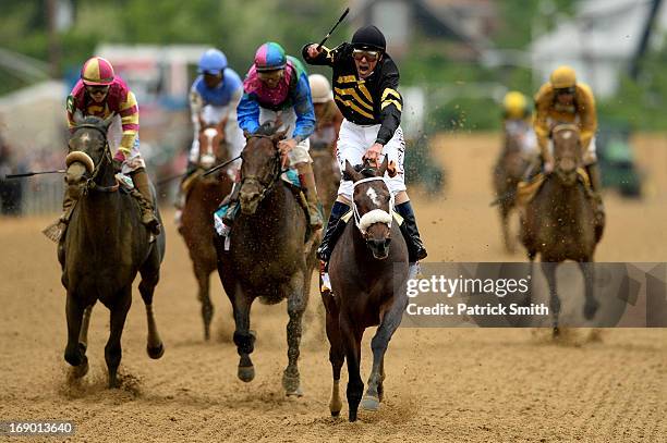 Oxbow, ridden by Gary Stevens, leads the field to the finish line to win the 138th running of the Preakness Stakes at Pimlico Race Course on May 18,...