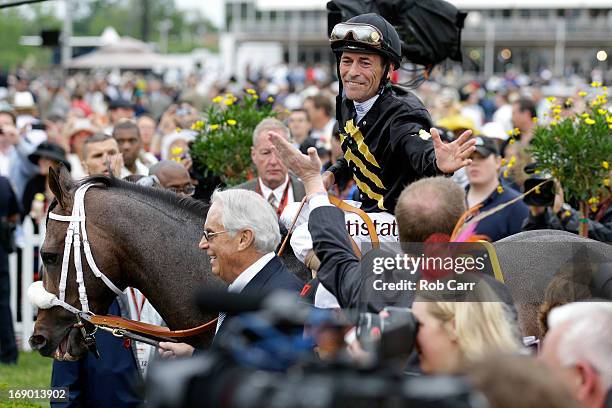 Trainer D. Wayne Lucas leads Oxbow, ridden by Gary Stevens to Winner's Circle after winning the 138th running of the Preakness Stakes at Pimlico Race...