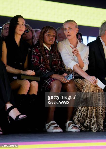 Kim Jisoo, Jackson Theron and Charlize Theron at Christian Dior Ready To Wear Spring 2024 held at the Jardin des Tuileries on September 26, 2023 in...