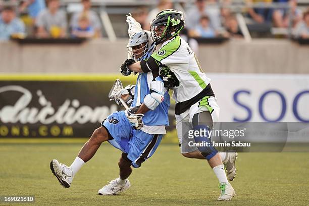 Mike Unterstein of the New York Lizards attempts to wrap up Chazz Woodson of the Ohio Machine in the first period on May 18, 2013 at Selby Stadium in...