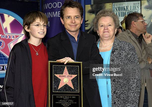 Actor Michael J. Fox poses with son Sam and mother Phyllis at the ceremony honoring him on the Hollywood Walk of Fame on December 16, 2002 in...