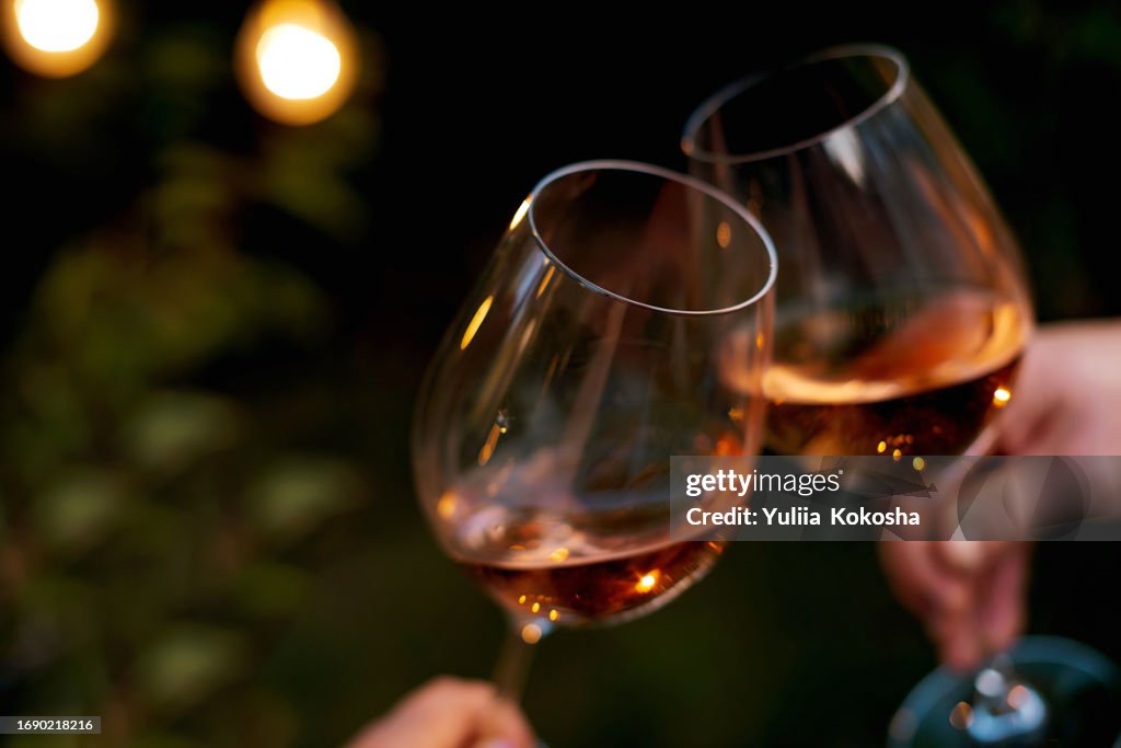 Couple toasting wine glasses