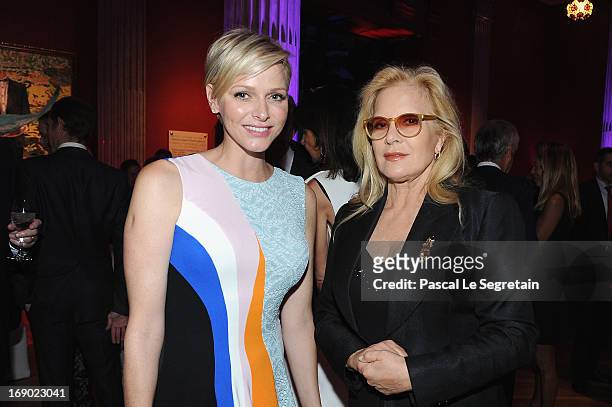 Princess Charlene of Monaco and Sylvie Vartan attend the Dior Cruise Collection 2014 cocktail on May 18, 2013 in Monaco, Monaco.