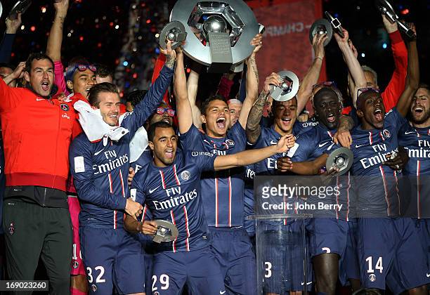 Paul Clement, David Beckham, Lucas Moura, captain Thiago Silva, Gregory Van Der Wiel, Mamadou Sakho, Blaise Matuidi, Jeremy Menez celebrate PSG's...
