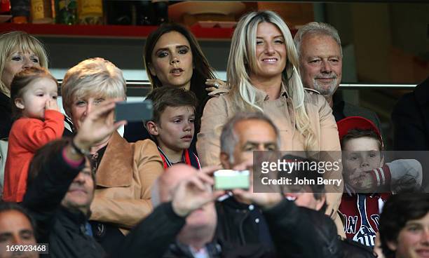 Harper Seven Beckham, David's daughter, Sandra Beckham, David's mother, Victoria Beckham, his wife, Joanne Beckham, David's sister attend the Ligue 1...