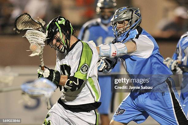 David Earl of the New York Lizards is slashed by Brett Garber of the Ohio Machine in the fourth period on May 18, 2013 at Selby Stadium in Delaware,...