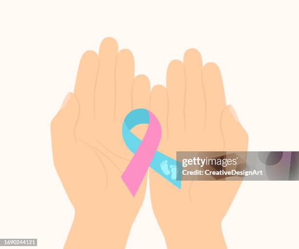 illustrazioni stock, clip art, cartoni animati e icone di tendenza di concetto di mese di sensibilizzazione sulla gravidanza e la perdita infantile. mano che tiene il nastro di consapevolezza rosa blu con impronta del bambino - fiocco nascita