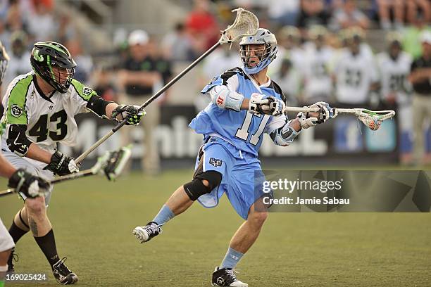 Will Harrington of the Ohio Machine looks to make a pass in the first period as Jack Reid of the New York Lizards defends on May 18, 2013 at Selby...