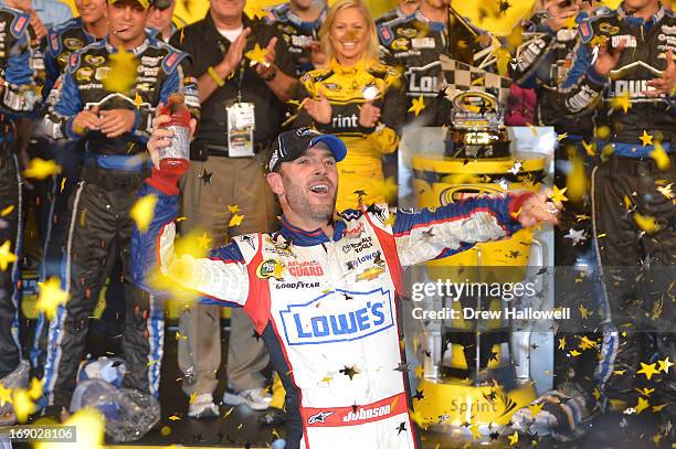 Jimmie Johnson, driver of the Lowe's Patriotic Chevrolet, celebrates in Victory Lane after winning the NASCAR Sprint Cup Series All-Star race at...