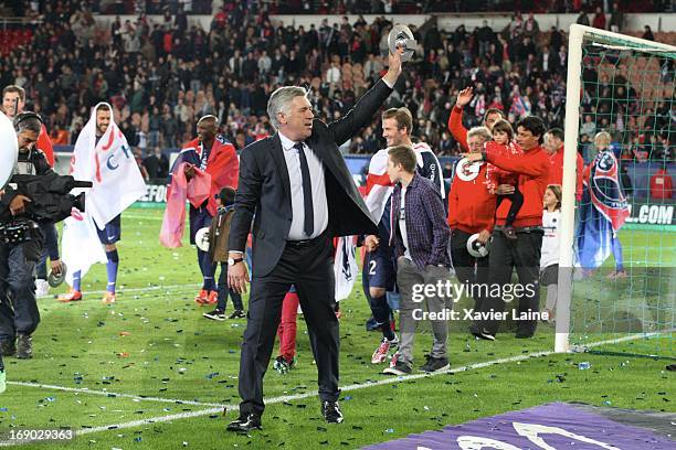 Carlo Ancelotti of Paris Saint-Germain celebrates after defeating Stade Brestois 29 at the French League 1 match at Parc des Princes on May 18, 2013...