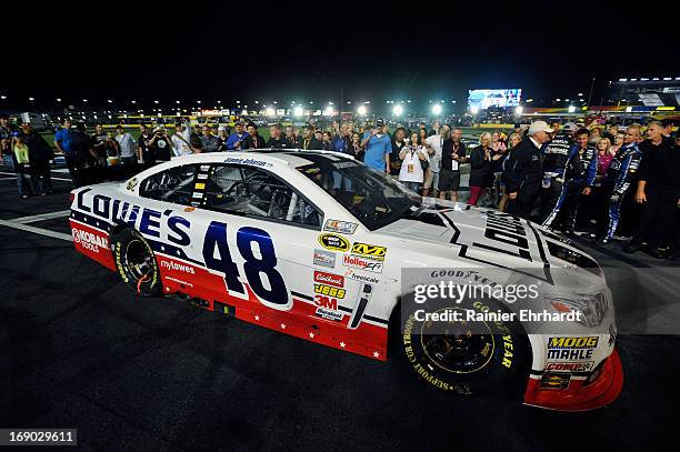 Jimmie Johnson, driver of the Lowe's Patriotic Chevrolet, pulls into Victory Lane after winning the NASCAR Sprint Cup Series All-Star race at...