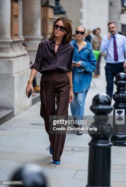 Alison Loehnis wears brown button shirt, pants outside Emilia Wickstead during London Fashion Week September 2023 at the on September 18, 2023 in...