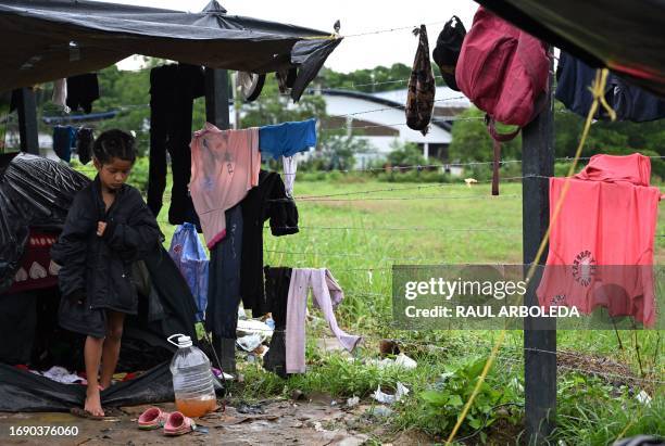 Venezuelan migrant child remains in an improvised tent in the Colombian port town of Turbo, close to the Darien Gap, a jungle shared by Colombia and...