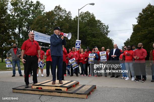 President Joe Biden addresses striking members of the United Auto Workers union at a picket line outside a General Motors Service Parts Operations...