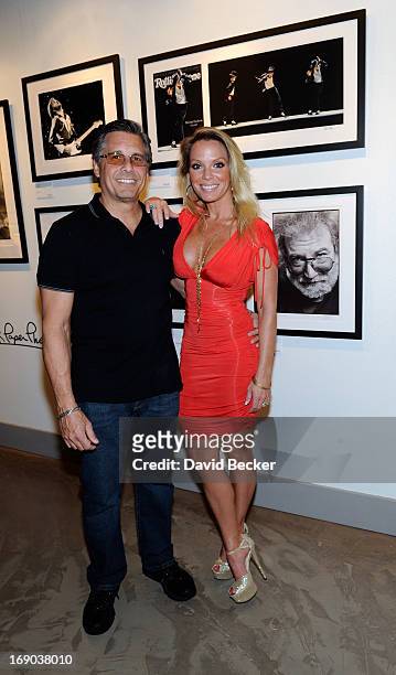 Photographer Kevin Mazur and his wife, Jennifer Mazur, appear at the grand opening of the Rock Paper Photo gallery inside the Hard Rock Hotel &...