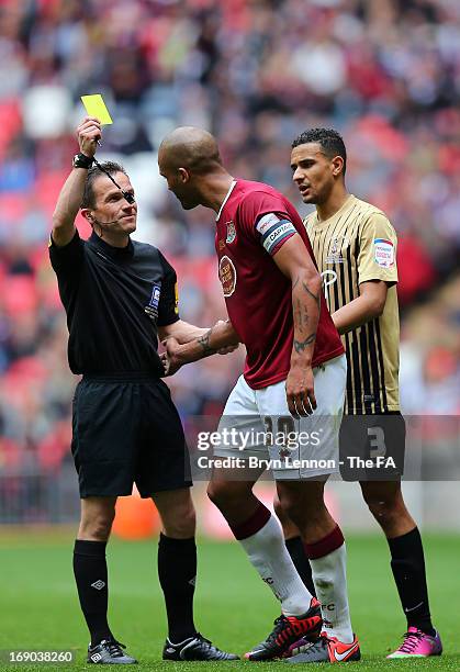 Referee Keith Stroud shows Clarke Carlisle a yellow card during the npower League Two Play Off Final between Bradford City and Northampton Town at...