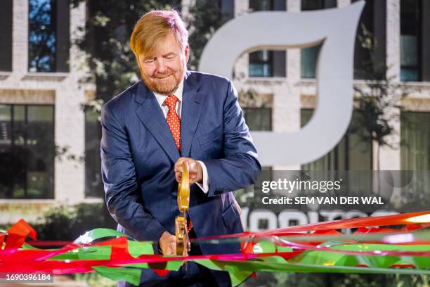 Dutch King Willem-Alexander cuts the ribbon on the opening day of the new Tergooi Medical Center, in Hilversum on September 26, 2023. The hospital is...