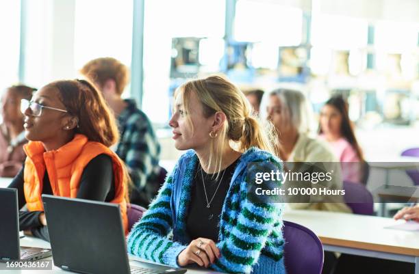 female student listening in class at technical college - technische hochschule stock-fotos und bilder