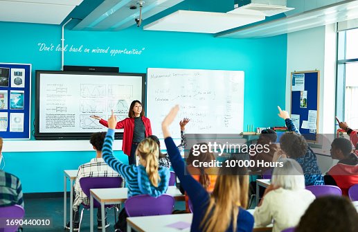 Technical college lecturer taking questions from class Technical college lecturer taking questions from class