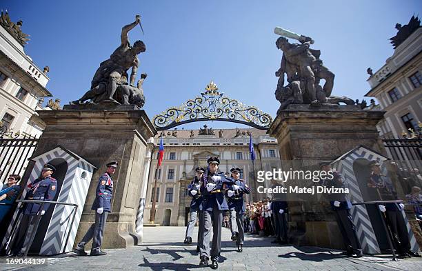 Members of the Castle guard changing at main gate of Prague Castle as tourists and locals watching on May 15, 2013 in Prague, Czech Republic. Prague...