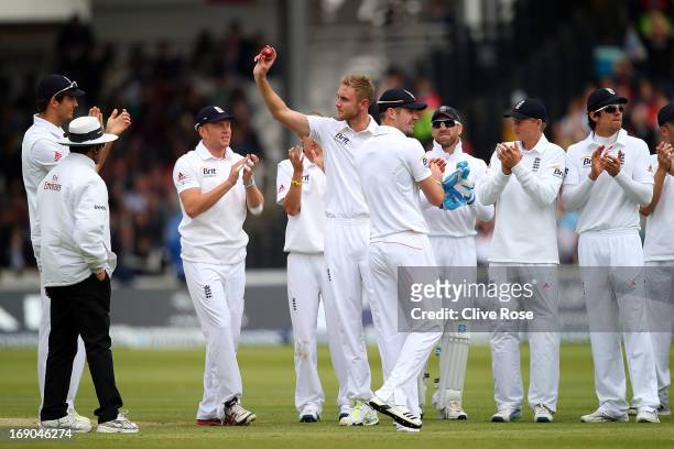 Stuart Broad of England raises the ball to acknoledge his five wicket haul during day four of 1st Investec Test match between England and New Zealand...