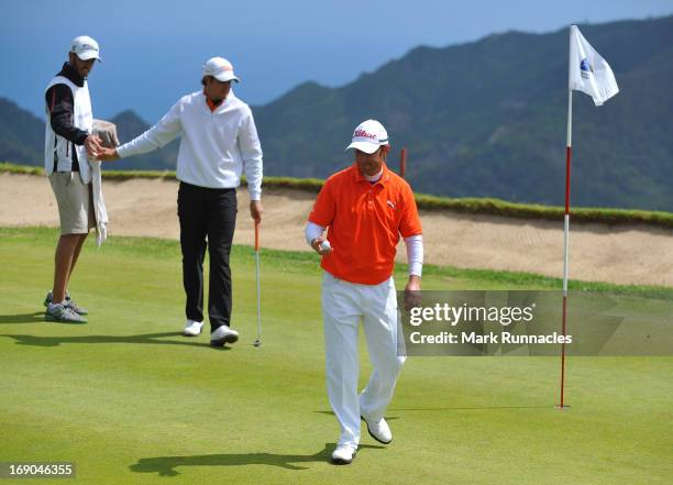 Mark Tullo of Argentina celebrates with his fellow players after a hole in one at the 4th hole during Day Four of the Madeira Islands Open - Portugal...