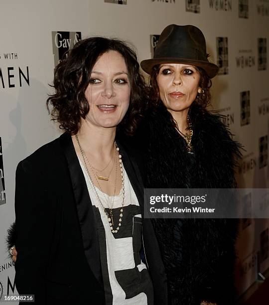 Actress Sara Gilbert and her partner producer/musician Linda Perry arrive at An Evening With Women benefiting The L.A. Gay & Lesbian Center at the...