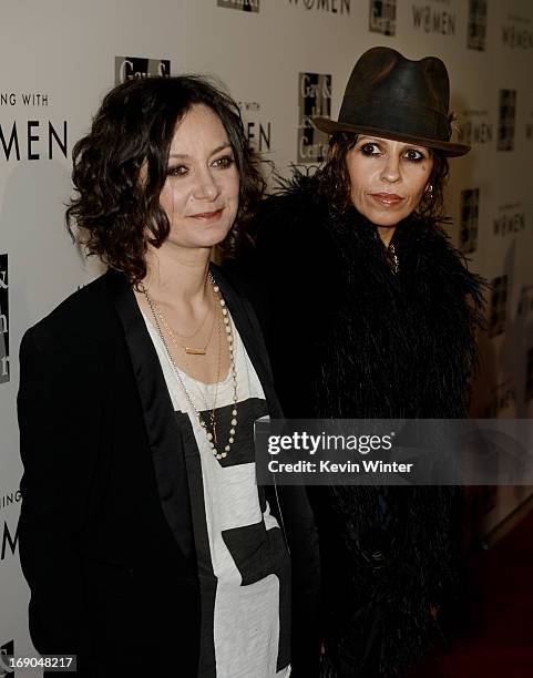 Actress Sara Gilbert and her partner producer/musician Linda Perry arrive at An Evening With Women benefiting The L.A. Gay & Lesbian Center at the...