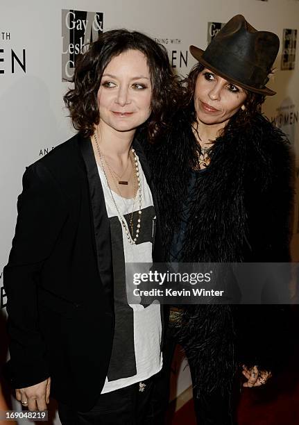 Actress Sara Gilbert and her partner producer/musician Linda Perry arrive at An Evening With Women benefiting The L.A. Gay & Lesbian Center at the...