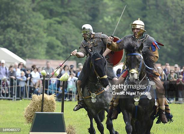 Actors dressed as Roman soldiers on horses shows fighting during a commemoration of the Battle of Teutoburg Forest at the Kalkriese Museum and Park...