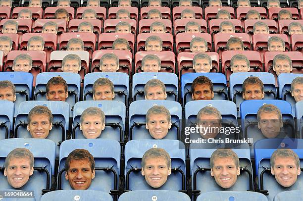 Masks of Stiliyan Petrov of Aston Villa are seen on seats ahead of the Barclays Premier League match between Wigan Athletic and Aston Villa at DW...