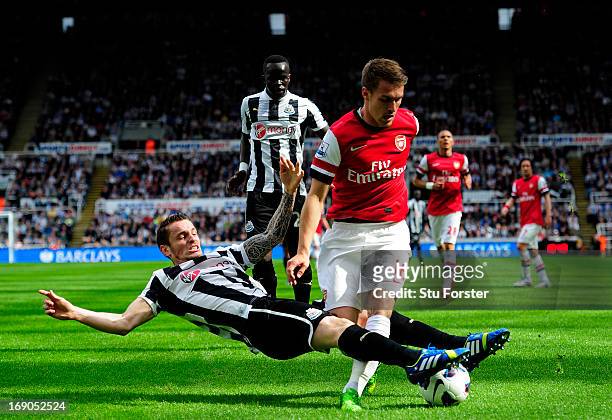 Mathieu Debuchy of Newcastle in action against Aaron Ramsey of Arsenal during the Barclays Premier League match between Newcastle United and Arsenal...