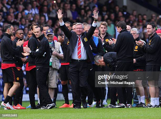 Manchester United manager Sir Alex Ferguson salutes the crowd prior his 1,500th and final match in charge of the club ahead of the Barclays Premier...