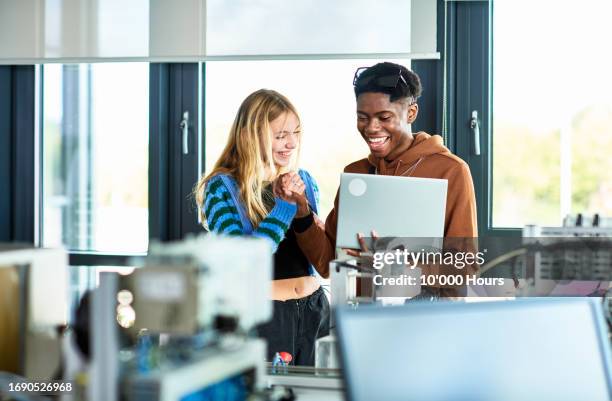 engineering students using laptop to work on project - greater london stock pictures, royalty-free photos & images