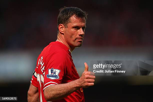 Jamie Carragher of Liverpool gives a thumbs up during the Barclays Premier League match between Liverpool and Queens Park Rangers at Anfield on May...