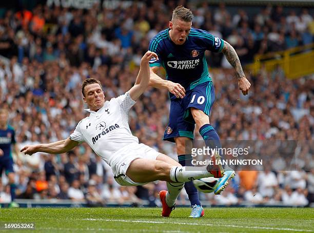 Tottenham Hotspur's English midfielder Scott Parker defends against a shot by Sunderland's English striker Connor Wickham during the English Premier...