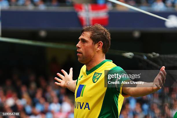 Grant Holt of Norwich City celebrates scoring during the Barclays Premier League match between Manchester City and Norwich City at Etihad Stadium on...